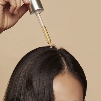 woman-applying-hair-serum