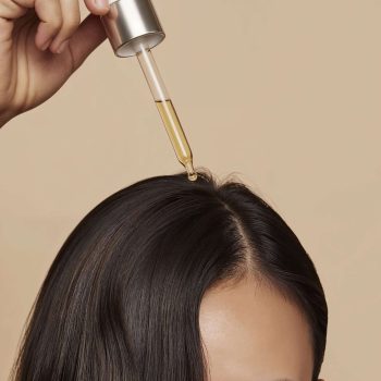 woman-applying-hair-serum